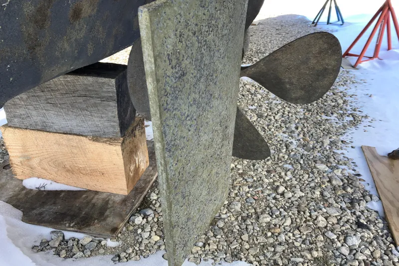 Slide: The Image of Propeller and rudder of 2001 Formula 37 Performance Cruiser on gravel with snow. - 62