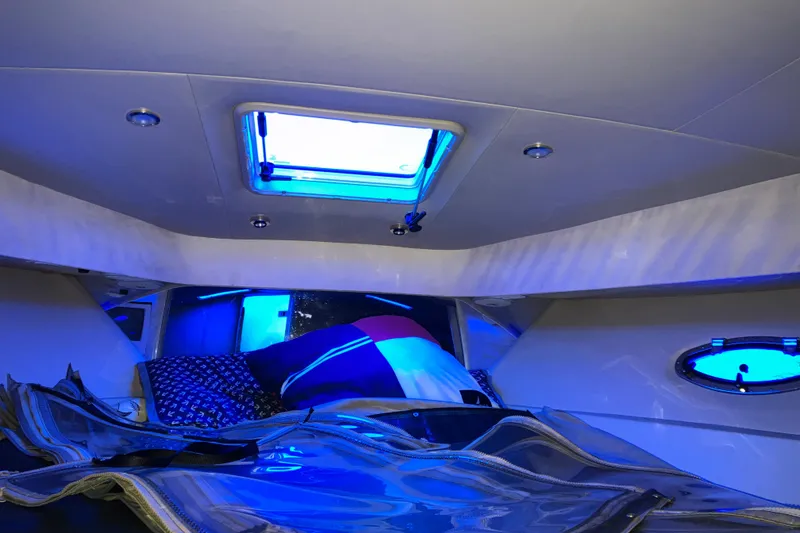 Slide: The Image of Interior cabin of 2001 Formula 37 Performance Cruiser with blue lighting and bedding. - 34