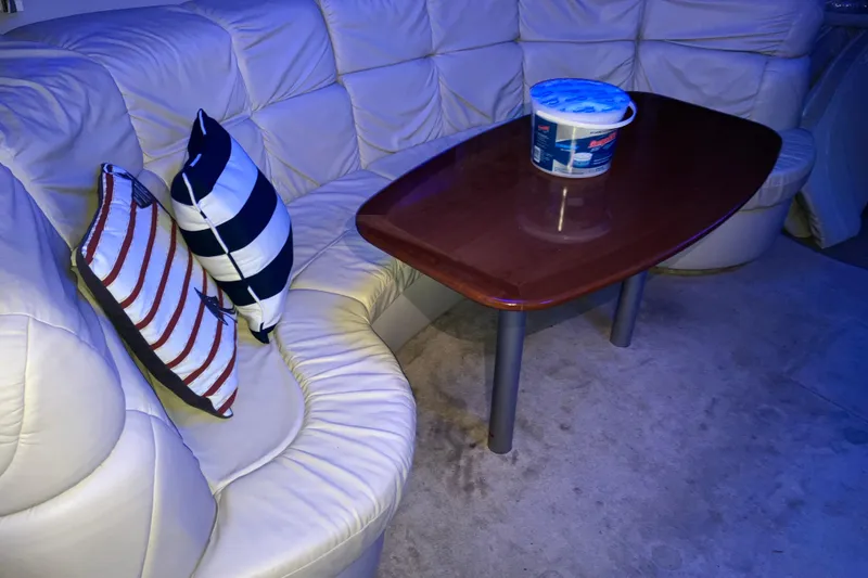 Slide: The Image of Interior of 2001 Formula 37 Performance Cruiser with leather seating and wooden table. - 22