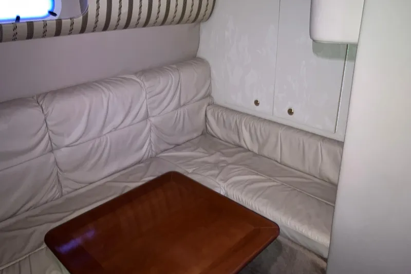Slide: The Image of Interior of 2001 Formula 37 Performance Cruiser with leather seating and wooden table. - 24