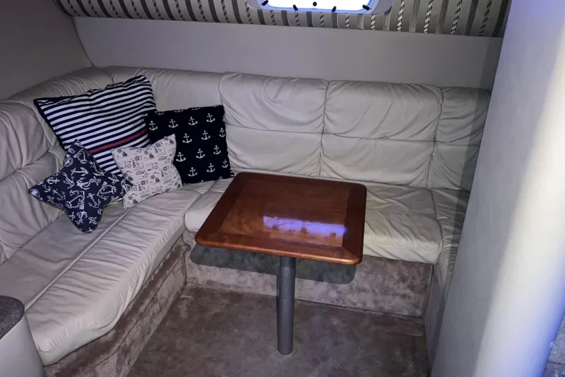 Slide: The Image of Interior of 2001 Formula 37 Performance Cruiser with cozy seating and nautical-themed pillows. - 23