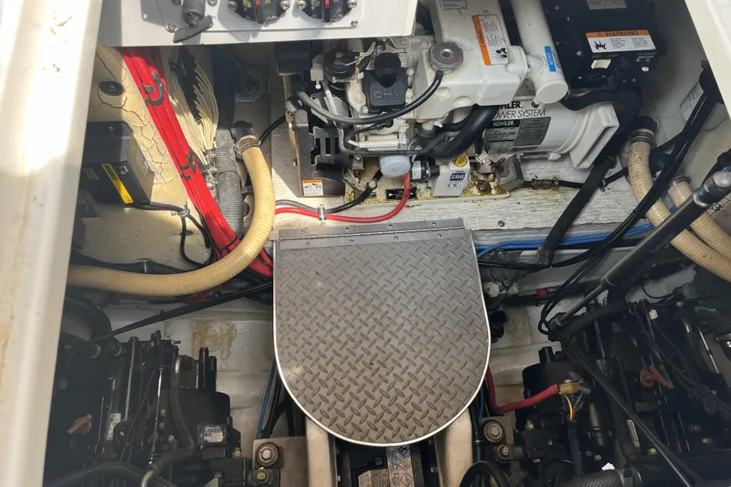 Slide: The Image of Engine compartment of a 2001 Formula 37 Performance Cruiser with visible components and wiring. - 3