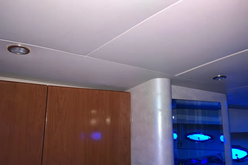 Slide: The Image of Interior of a 2001 Formula 37 Performance Cruiser with wood paneling and recessed lighting. - 33