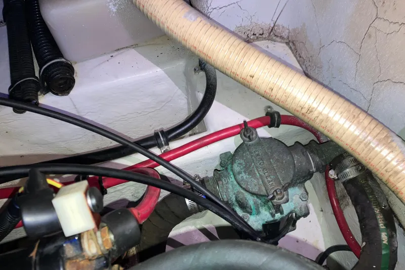Slide: The Image of Engine compartment of a 2001 Formula 37 Performance Cruiser with visible hoses and wiring. - 44