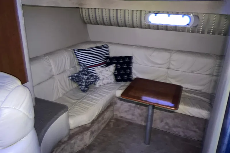 Slide: The Image of Interior of 2001 Formula 37 Performance Cruiser with cozy seating and nautical-themed pillows. - 29