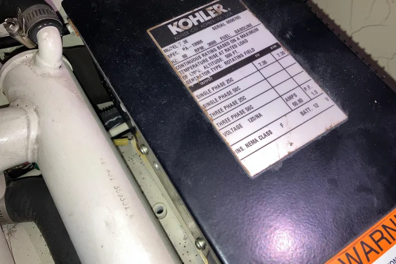 Slide: The Image of Engine compartment of 2001 Formula 37 Performance Cruiser with Kohler generator label. - 47