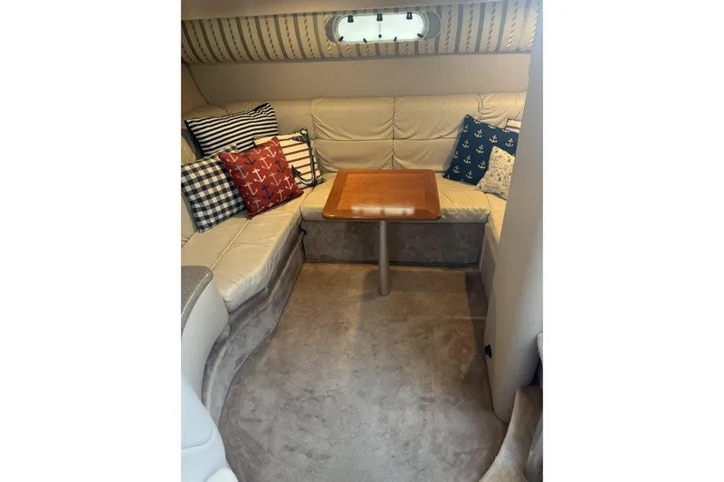 Slide: The Image of Interior of 2001 Formula 37 Performance Cruiser with cozy seating and nautical-themed pillows. - 8