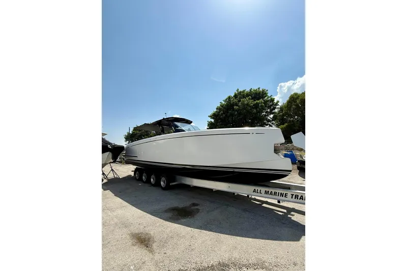 Slide: The Image of 2022 Pardo Yachts 38 on trailer under clear blue sky. - 23