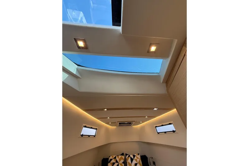 Slide: The Image of Interior view of 2022 Pardo Yachts 38 with skylight and modern lighting. - 25
