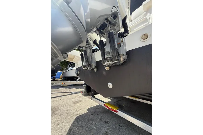 Slide: The Image of Rear view of 2022 Pardo Yachts 38 showing dual outboard motors on a trailer. - 26