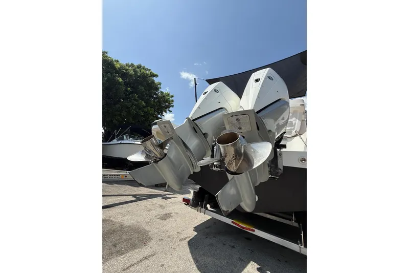 Slide: The Image of 2022 Pardo Yachts 38 with dual outboard motors, parked under a clear blue sky. - 27