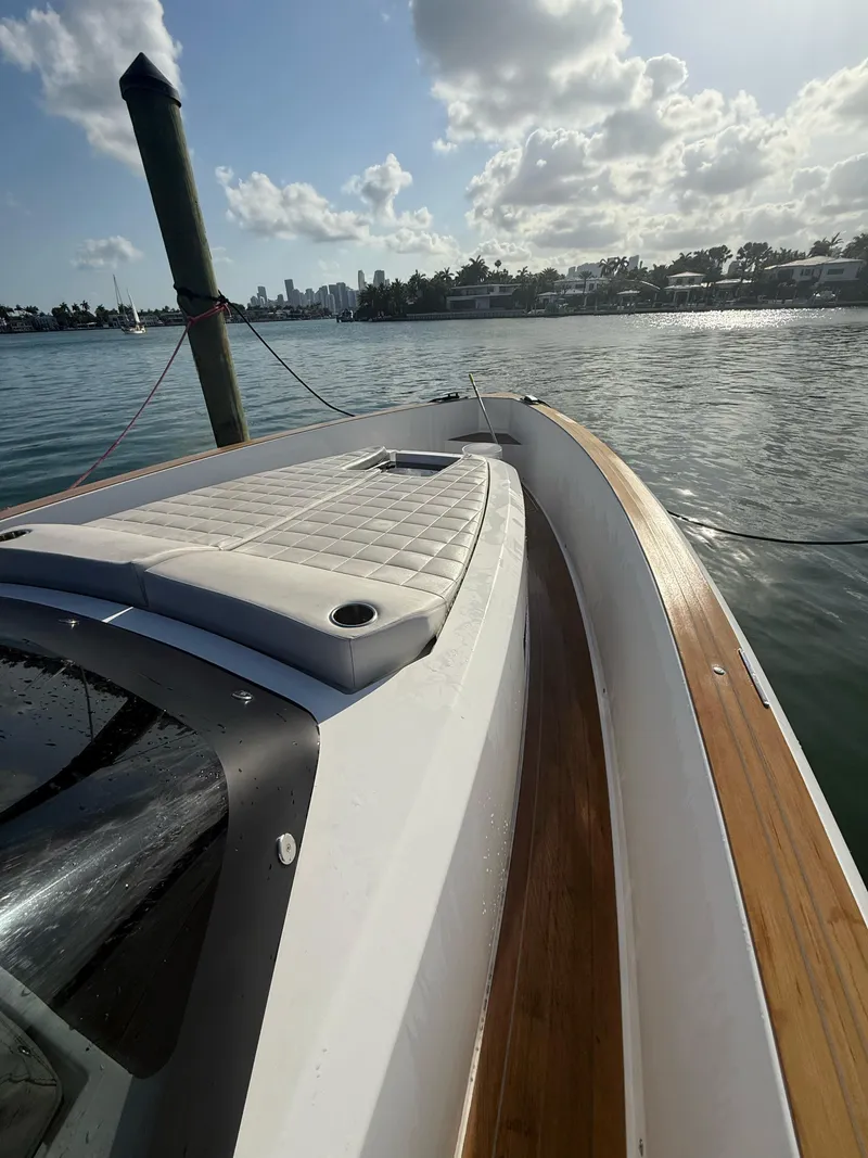 Slide: The Image of Pardo Yachts 38 (2022) deck detail with sleek wood finish and chrome accents. - 8