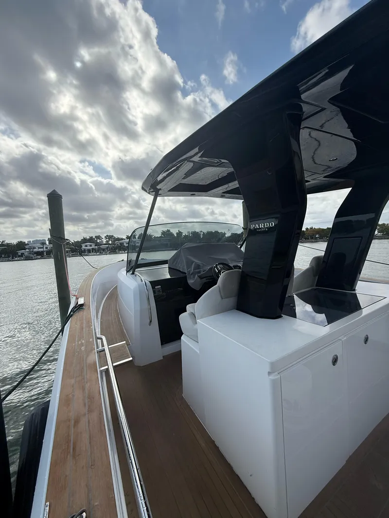 Slide: The Image of 2022 Pardo Yachts 38, sleek design, docked under cloudy sky. - 12
