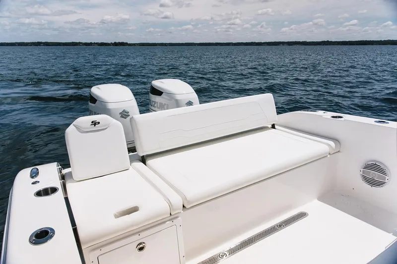 Slide: The Image of Manufacturer Provided Image: 2026 Sea Pro 265FLX Sandbar boat with dual Suzuki engines on open water. - 7
