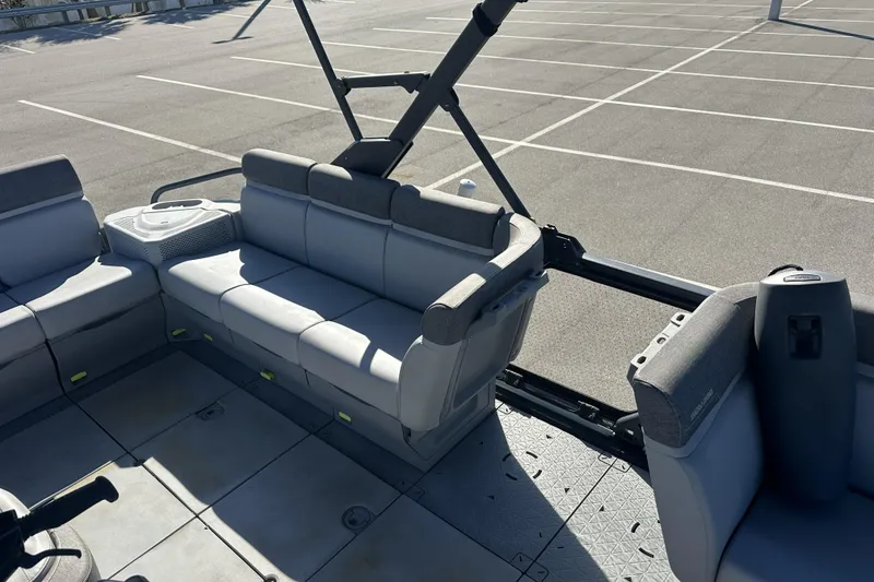 Slide: The Image of 2022 Sea-Doo Switch Sport 21 interior with gray seating and open deck layout. - 12