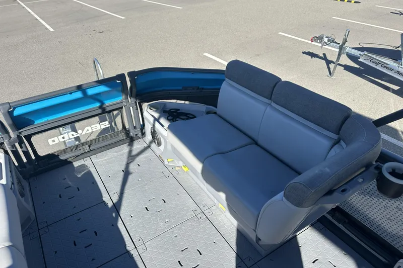 Slide: The Image of 2022 Sea-Doo Switch Sport 21 interior with gray seating and spacious deck layout. - 15