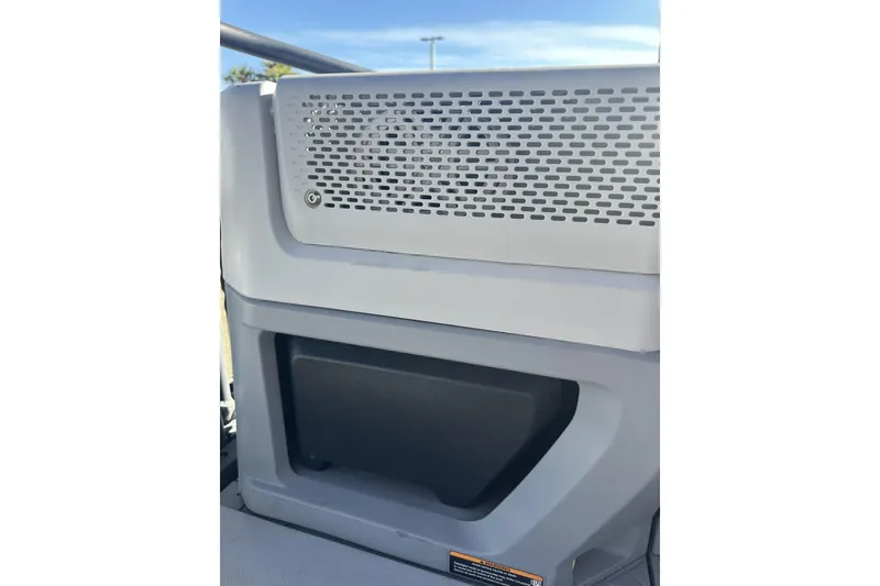 Slide: The Image of 2022 Sea-Doo Switch Sport 21 interior detail with vented panel and storage compartment. - 24