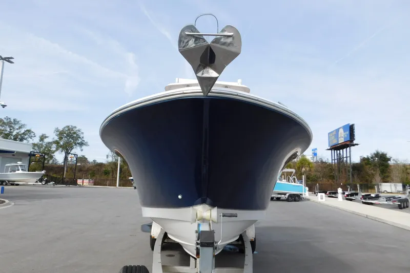 Slide: The Image of 2008 Wellcraft 27 Scarab Tournament boat on trailer, front view, outdoors. - 10