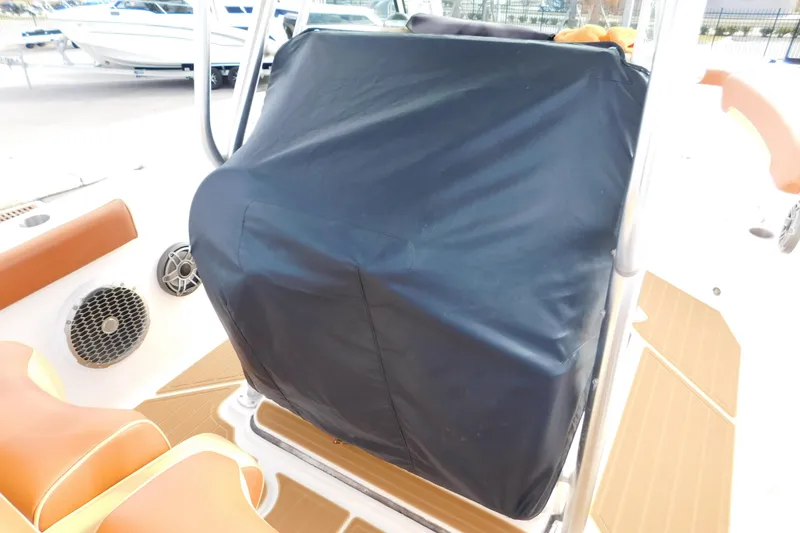 Slide: The Image of 2008 Wellcraft 27 Scarab Tournament boat interior with covered console and speaker. - 13