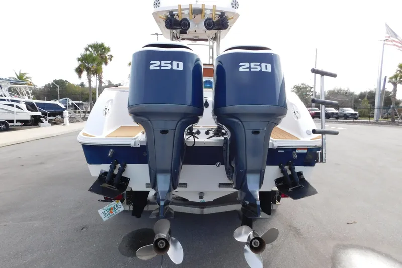Slide: The Image of 2008 Wellcraft 27 Scarab Tournament with dual 250 horsepower outboard motors, rear view. - 2