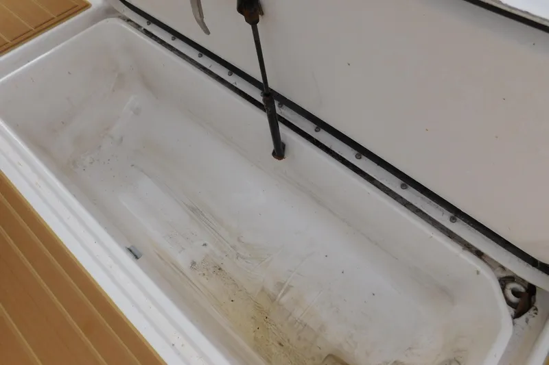 Slide: The Image of Open storage compartment on 2008 Wellcraft 27 Scarab Tournament boat. - 22