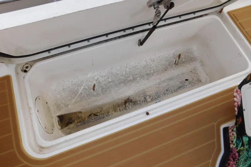 Slide: The Image of Open storage compartment on 2008 Wellcraft 27 Scarab Tournament boat, showing interior details. - 23