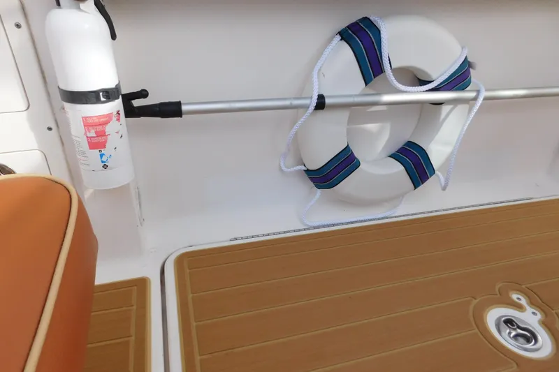 Slide: The Image of 2008 Wellcraft 27 Scarab Tournament boat interior with life preserver and fire extinguisher. - 24