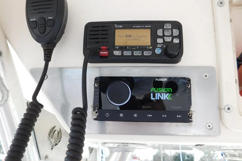 Slide: The Image of Control panel of a 2008 Wellcraft 27 Scarab Tournament with radio and Fusion Link system. - 36