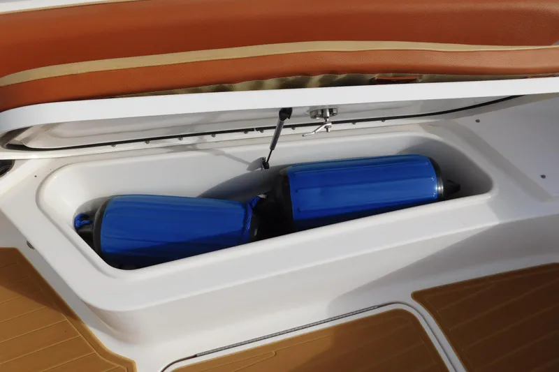 Slide: The Image of Storage compartment on 2008 Wellcraft 27 Scarab Tournament boat with blue fenders. - 42