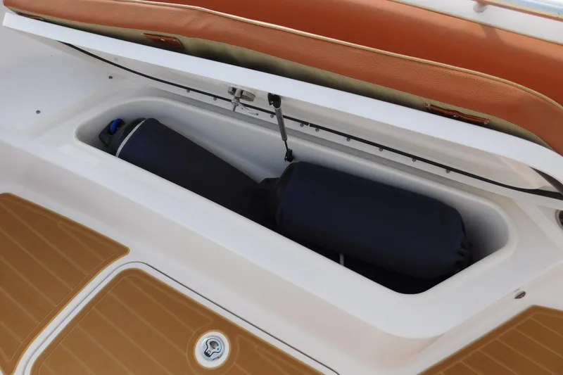 Slide: The Image of Storage compartment on 2008 Wellcraft 27 Scarab Tournament boat with fenders inside. - 43