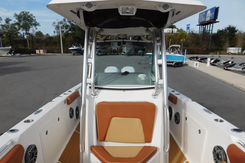 Slide: The Image of 2008 Wellcraft 27 Scarab Tournament boat with tan seating and modern design. - 46