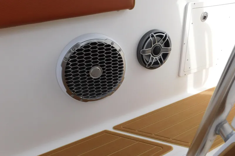 Slide: The Image of Speakers on 2008 Wellcraft 27 Scarab Tournament boat interior with teak flooring. - 52