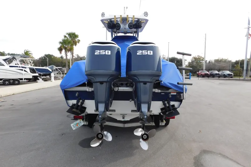 Slide: The Image of 2008 Wellcraft 27 Scarab Tournament boat with dual 250 horsepower engines, covered and parked. - 61