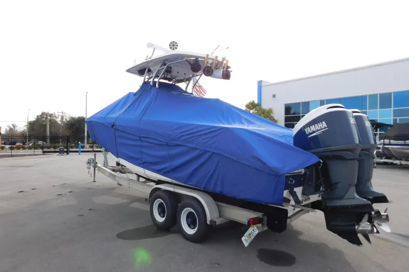 Slide: The Image of 2008 Wellcraft 27 Scarab Tournament boat covered, on trailer, with twin Yamaha engines. - 62