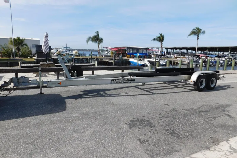 Slide: The Image of Boat trailer at marina for 2008 Wellcraft 27 Scarab Tournament, palm trees in background. - 64