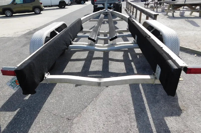 Slide: The Image of Boat trailer for 2008 Wellcraft 27 Scarab Tournament, parked on asphalt. - 66