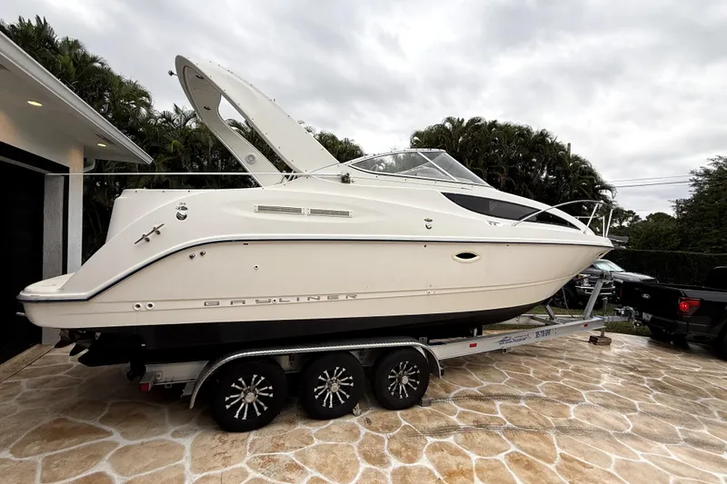 Slide: The Image of 2003 Bayliner 2855 Ciera boat on trailer under clear blue sky. - 2