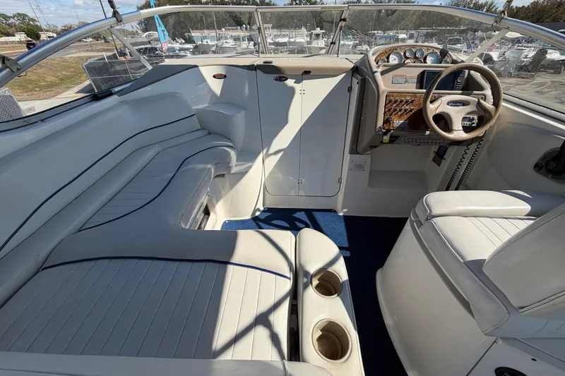 Slide: The Image of 2003 Bayliner 2855 Ciera boat interior with seating, steering wheel, and control panel. - 21
