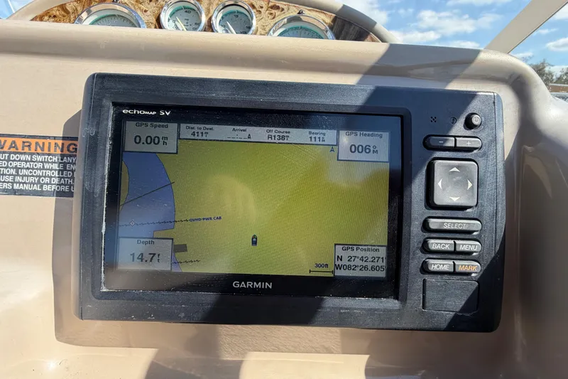 Slide: The Image of Garmin GPS display on 2003 Bayliner 2855 Ciera boat dashboard, showing navigation details. - 25