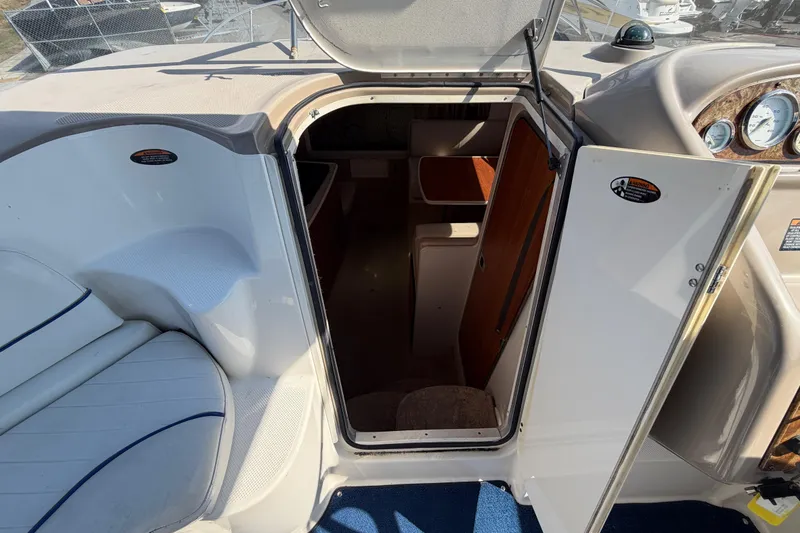 Slide: The Image of 2003 Bayliner 2855 Ciera cabin entrance with open door, showcasing interior space. - 28