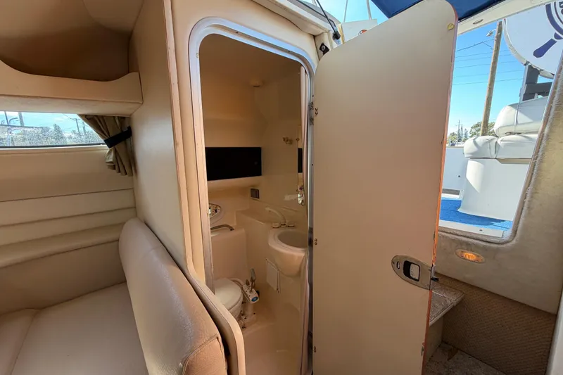Slide: The Image of 2003 Bayliner 2855 Ciera interior showing cabin and compact bathroom. - 32