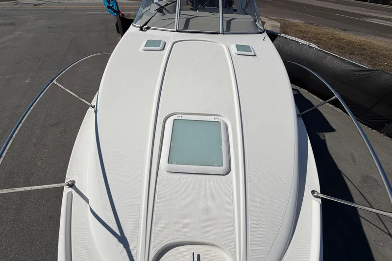 Slide: The Image of 2003 Bayliner 2855 Ciera boat deck with hatches and railing. - 43