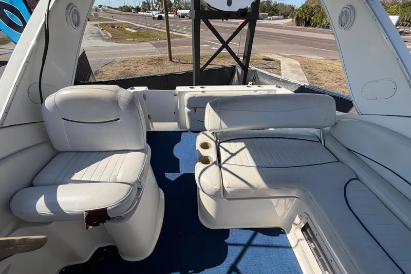 Slide: The Image of 2003 Bayliner 2855 Ciera boat interior with white seating and blue carpet. - 46