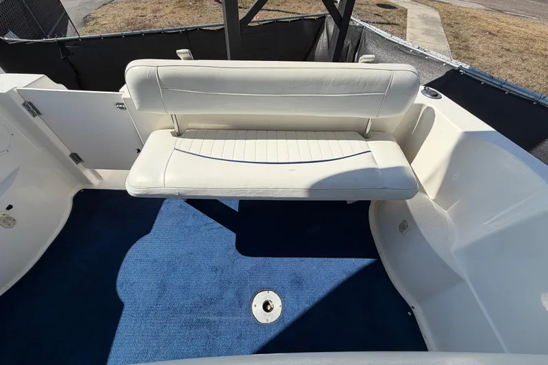 Slide: The Image of 2003 Bayliner 2855 Ciera boat interior with white seating and blue carpet. - 48