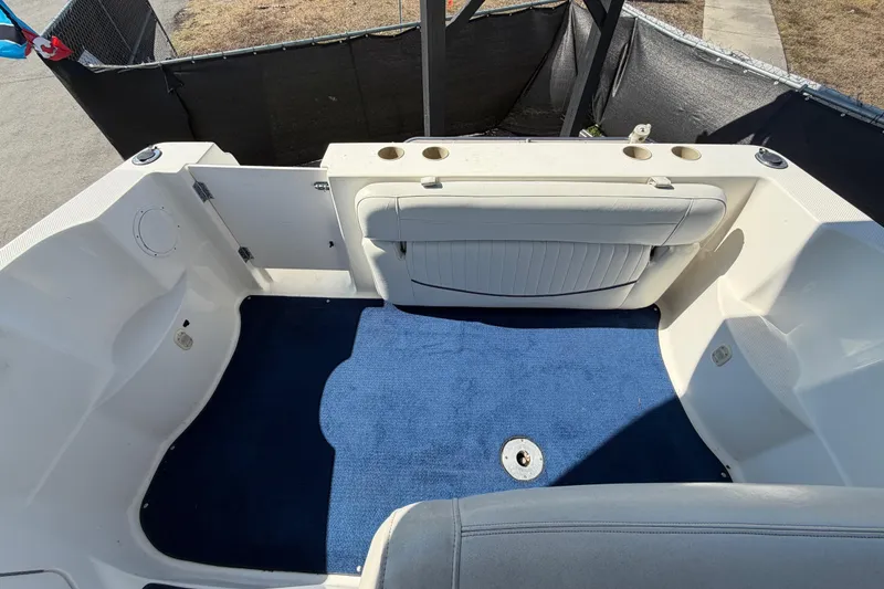 Slide: The Image of 2003 Bayliner 2855 Ciera boat interior with blue carpet and white seating. - 49