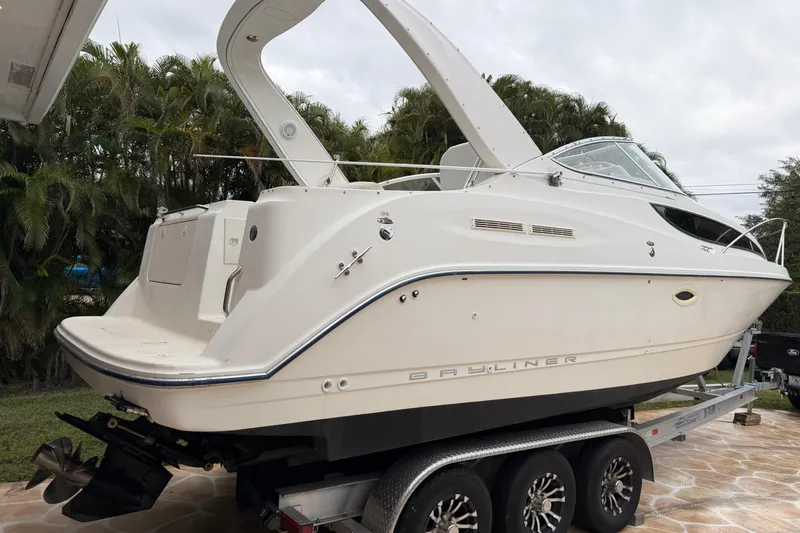 Slide: The Image of 2003 Bayliner 2855 Ciera boat on trailer under clear blue sky. - 5