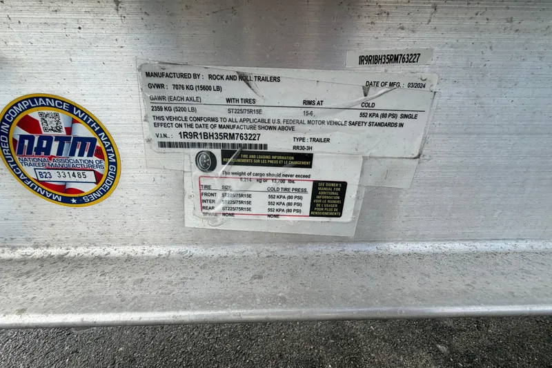 Slide: The Image of 2003 Bayliner 2855 Ciera trailer compliance label with specifications and safety standards. - 51