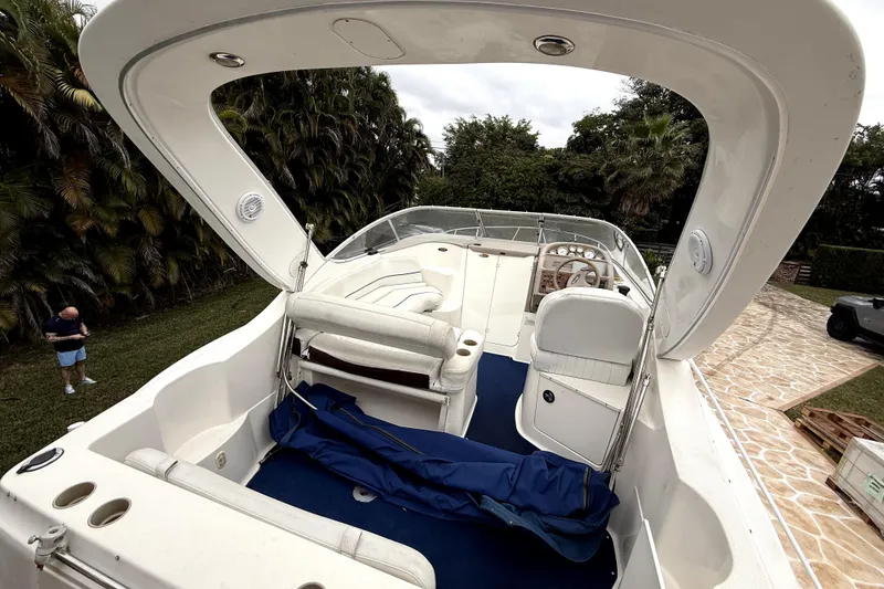 Slide: The Image of 2003 Bayliner 2855 Ciera boat on trailer, parked outdoors under clear blue sky. - 7