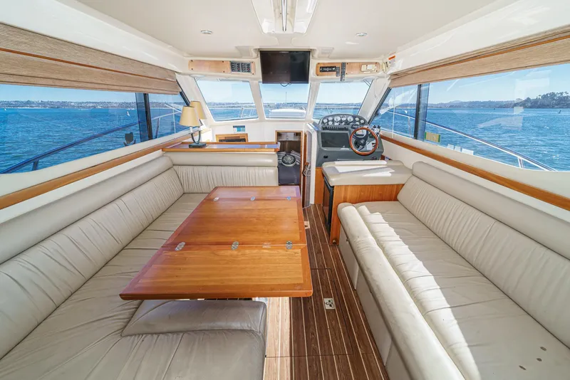 Slide: The Image of Interior of 2006 Riviera 33 Open Flybridge yacht with spacious seating and ocean view. - 3