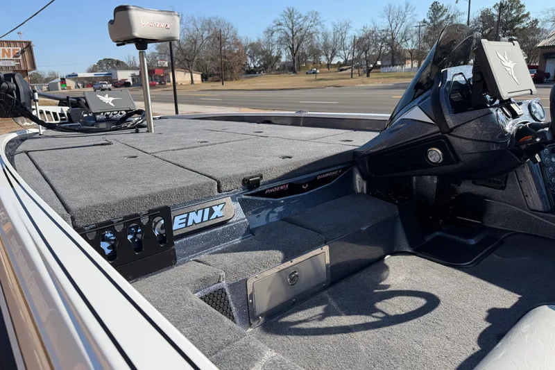 Slide: The Image of 2026 Phoenix 921 Elite X II boat interior with advanced dashboard and spacious deck. - 8